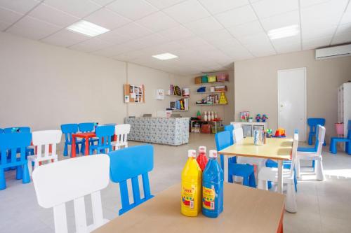 a classroom with chairs and bottles on a table at Hotel Best Cap Salou in Salou