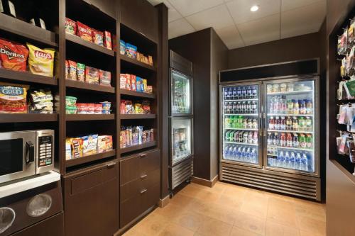 a drink aisle in a grocery store with vending machines at Courtyard by Marriott El Paso East/I-10 in El Paso