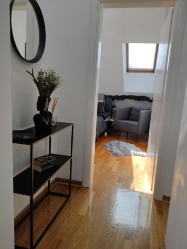 a living room with a table and a mirror at City011 in Belgrade
