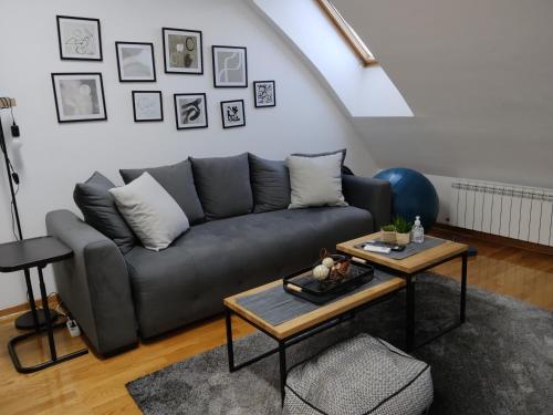 a living room with a couch and a table at City011 in Belgrade