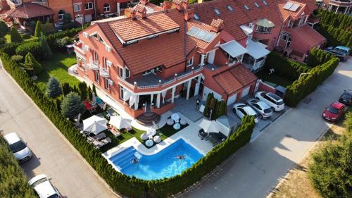 an overhead view of a large house with a swimming pool at Lux Villa Mitimago in Niš