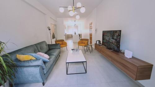 a living room with a couch and a fireplace at STAY Vital Elegance in Limassol