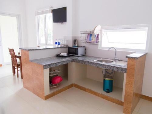 Η κουζίνα ή μικρή κουζίνα στο Mui Ne Volga Hotel & Apartments
