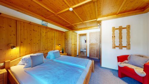 Ένα ή περισσότερα κρεβάτια σε δωμάτιο στο Chalet Tirol Waidring