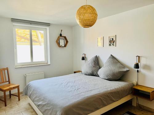 a bedroom with a large bed and a window at Wohnung Pauli, FW 2 in Zingst