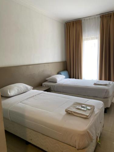 Katil atau katil-katil dalam bilik di Belvena Makati Hotel