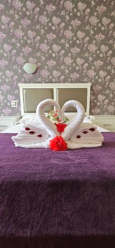 Una cama o camas en una habitación de Hotel Olimp