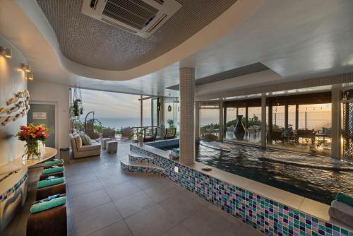 a swimming pool in a house with a swimming poolvisor at Views Boutique Hotel & Spa in Wilderness