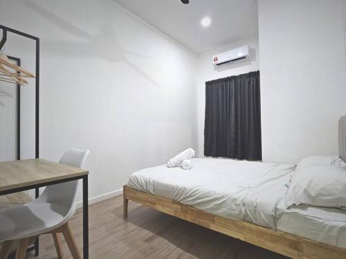 a white bedroom with a bed and a desk and a window at H+M Residence II [3km] to Setia City Convention in Klang