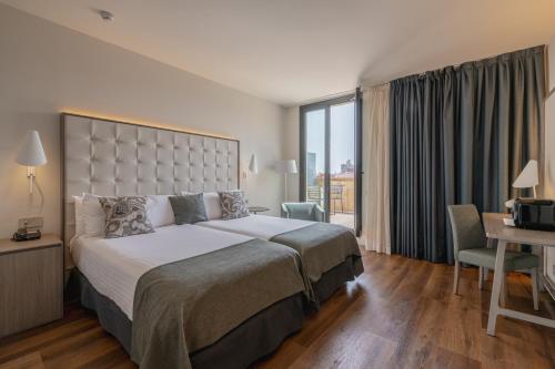 A bed or beds in a room at Gran Hotel Havana 4Sup by Escampa Hotels