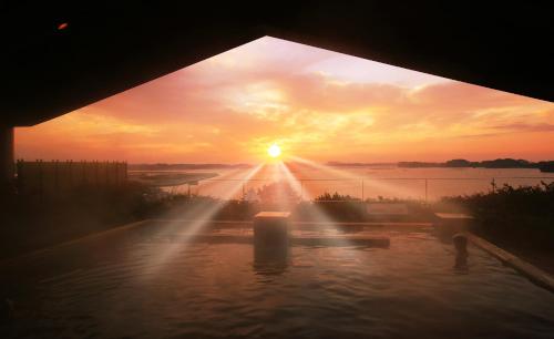 a view of the sunset from a water fountain at Matsushima Ichinobo in Matsushima