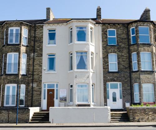 a large brick building with blue windows at The Waterside in Redcar
