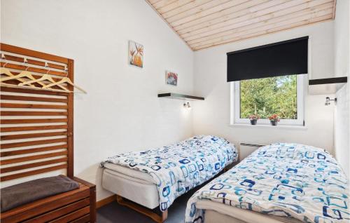 A bed or beds in a room at Lovely Home In Fjerritslev With Wifi