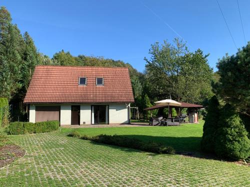 a small house with a gazebo in a yard at Ubytování Čeladná in Čeladná
