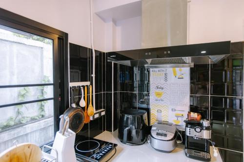 a kitchen with a counter top with a coffee maker at LD8 House Private Pool Perfect Groups -Families ChiangMai in Chiang Mai