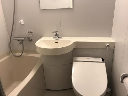 a small bathroom with a sink and a toilet at Aizu Tsuruya Hotel - Vacation STAY 57216v in Aizuwakamatsu
