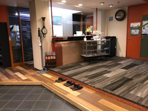 a store with shoes on the floor of a lobby at Aizu Tsuruya Hotel - Vacation STAY 57204v in Aizuwakamatsu