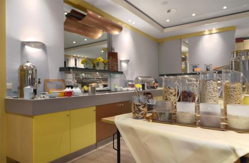 a kitchen with a table with jars of food at Trip Inn Landhotel Badsoden-Salmünster in Bad Soden-Salmünster