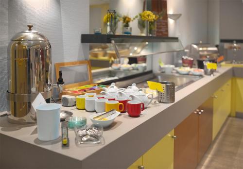 a counter in a restaurant kitchen with food on it at Trip Inn Landhotel Badsoden-Salmünster in Bad Soden-Salmünster