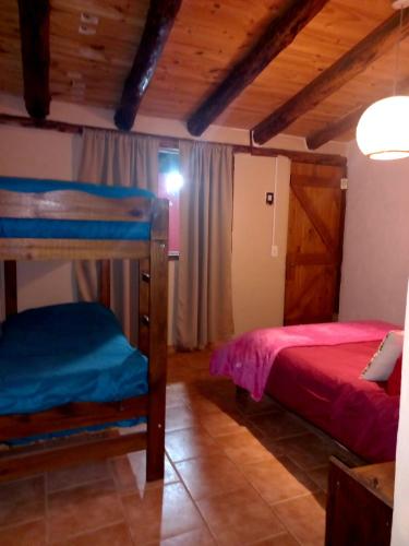 Llit o llits en una habitació de Cabañas Los Nonos
