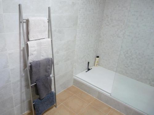 a bathroom with a shower with a glass door at Modern Apartment Near Beach in La Mata