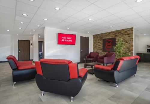 a waiting room with chairs and a sign in a hospital at Red Roof Inn Lancaster, TX in Lancaster