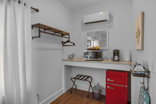 a kitchen with a red cabinet and a red refrigerator at Little Inn on Main in Washington