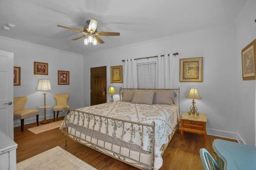 a bedroom with a bed and a ceiling fan at Little Inn on Main in Washington