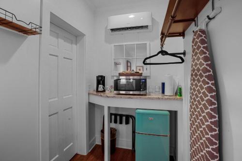 a small kitchen with a counter with a microwave at Little Inn on Main in Washington