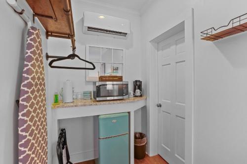 a small kitchen with a counter and a microwave at Little Inn on Main in Washington