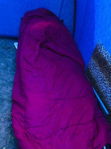 a pink sleeping bag sitting in a tent at Imighlad in Marrakech