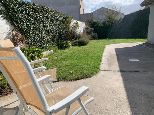 a rocking chair sitting on the side of a driveway at PataGo! Sea&Sand in Playa Unión