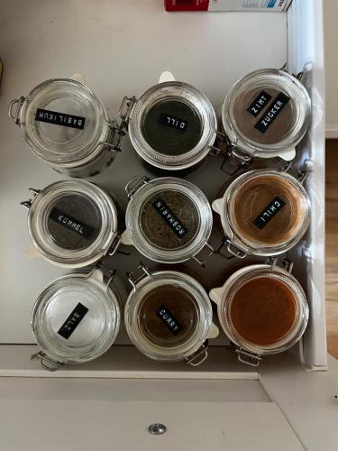 a bunch of pots and pans in a refrigerator at Ferienwohnung Gartenglück in Traunstein