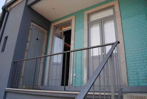 a house with a balcony and a door at Gaia Loves You - Ponte D. Luis in Vila Nova de Gaia