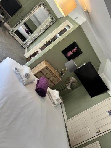 an overhead view of a bedroom with a bed and a mirror at The Plough Inn in Marsham