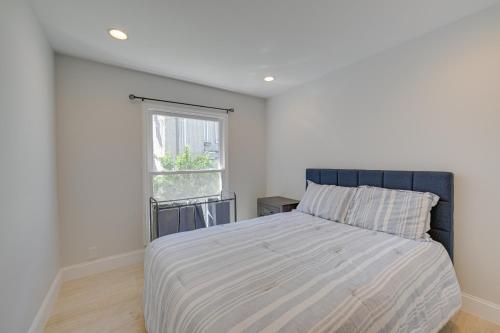 a bedroom with a bed and a window at Spacious Rocky Point Retreat with Al Fresco Dining! in Rocky Point