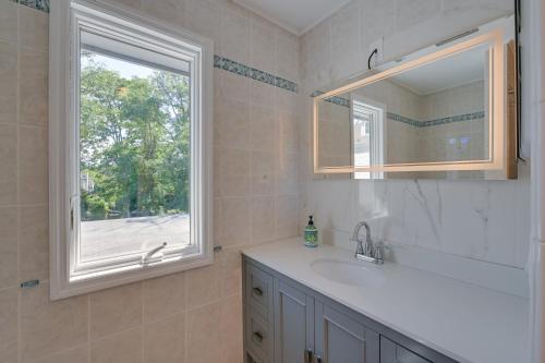 a bathroom with a sink and a window at Spacious Rocky Point Retreat with Al Fresco Dining! in Rocky Point
