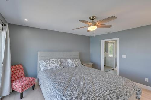 a bedroom with a bed and a ceiling fan at Spacious Rocky Point Retreat with Al Fresco Dining! in Rocky Point
