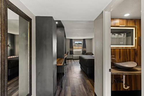 a hallway leading to a living room and a bedroom at Scottish Inns Austin Downtown in Austin