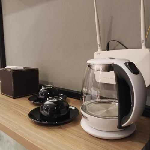 a blender sitting on a counter next to a microwave at MESA Thamrin City Apartments at Nagoya with Netflix & Pick Up Service in Nagoya