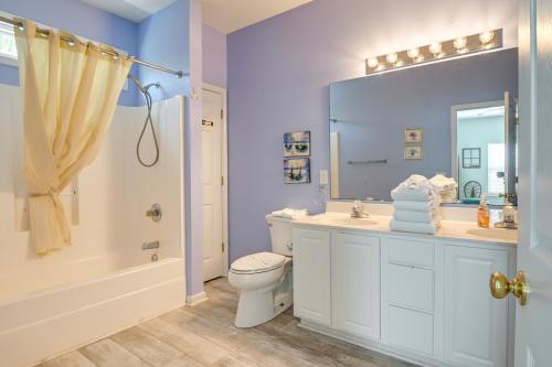 a bathroom with a toilet and a sink and a shower at Surfside Beach House with Pool, Walk to Beach and Pier in Myrtle Beach
