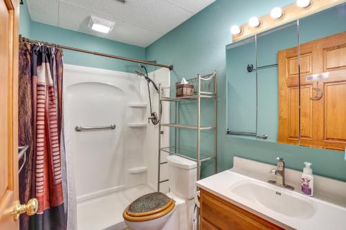 a bathroom with a shower and a toilet and a sink at The Apartment Retreat Near Mount Rushmore in Hermosa