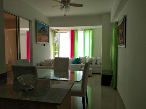 a living room with a glass table and a couch at Boca del mar, apartamento 207/206 in Cuevas