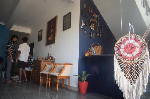 a group of people standing in a room at travstel & casa de neel in Puducherry