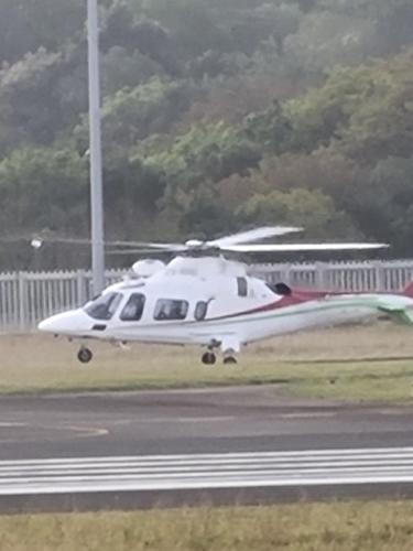a white helicopter is taking off from a runway at Airport Airbnb in Richards Bay
