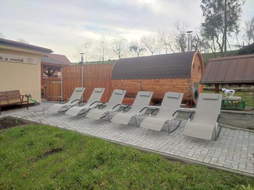 a group of chairs sitting on a patio at Agroturistika - "Domeček u oveček" in Horní Těrlicko