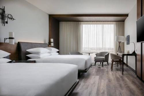 A bed or beds in a room at Odessa Marriott Hotel & Conference Center