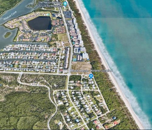 a map of a parking lot next to the water at Hutchinson Island Beachfront - 2bd, 2ba Ensuite in Fort Pierce