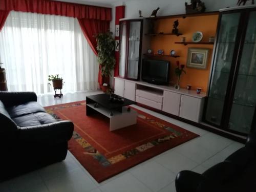 TV a/nebo společenská místnost v ubytování Piso Vacacional Carballeira