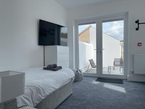Ένα ή περισσότερα κρεβάτια σε δωμάτιο στο Wind and Waves Apartment by Seaside Llandudno